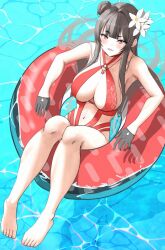 1girl black_gloves blush breasts brown_hair flower foguma gloves goddess_of_victory:_nikke hair_bun hair_flower hair_ornament half_gloves highres innertube large_breasts long_hair looking_at_viewer one-piece_swimsuit red_innertube red_one-piece_swimsuit sitting solo swim_ring swimsuit very_long_hair water yan_(nikke) yan_(sunrise_market)_(nikke)