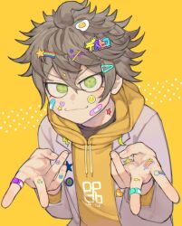 Rule 34 | 1boy, bandaid, bandaid on face, bandaid on hand, black shirt, brown hair, character name, closed mouth, commentary request, crescent, decora, desuhiko thunderbolt, double v, fried egg, green eyes, grey jacket, hair ornament, hairpin, heart, hood, hood down, hoodie, jacket, long sleeves, looking at viewer, male focus, master detective archives: rain code, natto rain, pin, rainbow, shirt, short hair, smile, smiley face, solo, star (symbol), star in eye, sticker on face, symbol in eye, upper body, v, v-shaped eyebrows, x hair ornament, yellow background, yellow hoodie