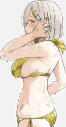 1girl bikini blue_eyes breasts cowboy_shot from_side gold_bikini grey_hair hair_ornament hair_over_one_eye hairpin halterneck hamakaze_(kancolle) hand_on_own_head highres kantai_collection large_breasts looking_at_viewer medium_hair off_shoulder sideboob simple_background solo swimsuit wasavi_8