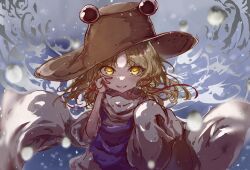 Rule 34 | 1girl, blonde hair, blush, brown hat, commentary request, floating hair, glowing, glowing eyes, grin, hair ribbon, hand on own cheek, hand on own face, hat, highres, long sleeves, looking at viewer, medium hair, moriya suwako, myui17901139, parted bangs, purple vest, red ribbon, ribbon, shirt, smile, touhou, turtleneck, vest, water, white shirt, yellow eyes