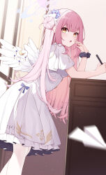 Rule 34 | 1girl, :o, absurdres, blue archive, blunt bangs, breasts, capelet, crescent, dress, elbows on table, feathered wings, feet out of frame, flower, from side, hair bun, hair flower, hair ornament, halo, highres, holding, holding pen, leaning forward, long hair, looking at viewer, looking to the side, medium breasts, mika (blue archive), motion blur, open mouth, pantyhose, paper airplane, pen, pink hair, poinia, purple flower, single side bun, solo, standing, very long hair, white capelet, white dress, white pantyhose, white wings, wing ornament, wings, yellow eyes