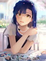 Rule 34 | 1girl, :d, asymmetrical bangs, bead necklace, beads, black bow, blue hair, blush, bow, braid, chair, commentary request, cup, day, hand on own shoulder, hinoshita akame, idolmaster, idolmaster million live!, jewelry, looking at viewer, medium hair, nanao yuriko, necklace, on chair, open mouth, outdoors, petals, photo (object), pov across table, see-through, short sleeves, sitting, smile, solo, sunlight, table, tareme, tea, teacup, upper body, yellow eyes