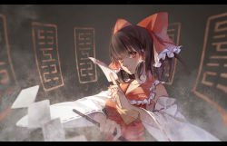 Rule 34 | 1girl, between fingers, bow, brown hair, detached sleeves, dress, gohei, hair bow, hair tubes, hakurei reimu, highres, holding, letterboxed, long sleeves, looking at viewer, momozi (mkingnight), red dress, red eyes, shaded face, solo, spell card, touhou, upper body, wide sleeves
