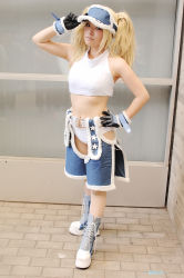 Rule 34 | 1girl, blonde hair, blue eyes, blue mary, chaps, cosplay, gloves, halterneck, halterneck, kof: maximum impact, long hair, midriff, nogu, photo (medium), snk, solo, the king of fighters, twintails