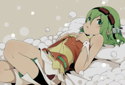 Rule 34 | 1girl, bad id, bad pixiv id, bubble, goggles, goggles on head, green eyes, green hair, gumi, looking at viewer, lying, matching hair/eyes, ogipote, on back, short hair, skirt, solo, vocaloid, wrist cuffs