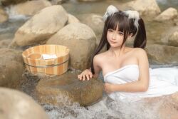 Rule 34 | 1girl, anal tail, animal ears, black hair, breasts, bucket, butt plug, chunmomo0127, cleavage, closed mouth, fake animal ears, fake tail, in water, looking at viewer, medium breasts, outdoors, photo (medium), real life, rock, sex toy, smile, tail, towel, twintails, water
