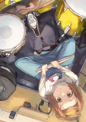 Rule 34 | 1girl, brown hair, drum, drum set, drumsticks, forehead, from above, hairband, highres, holding, holding drumsticks, indian style, instrument, k-on!, looking at viewer, looking up, otsudou, shirt, sitting, solo, tainaka ritsu, white shirt, yellow hairband