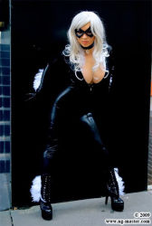 Rule 34 | 1girl, against wall, black cat (marvel), bodysuit, boots, breasts, cleavage, collar, cosplay, female focus, high heel boots, high heels, jewelry, large breasts, long hair, marvel, mask, necklace, photo (medium), shoes, skin tight, solo, spider-man (series), white hair, yaya han