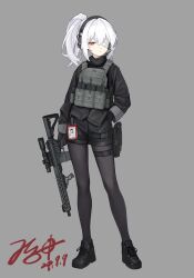 1girl absurdres ar-15 assault_rifle bandage_over_one_eye black_pantyhose bulletproof_vest girls&#039;_frontline grey_hair gun headphones highres jerry_wang m4_carbine m4a1_(girls&#039;_frontline) one_eye_closed one_eye_covered pantyhose red_eyes rifle short_shorts shorts standing tachi-e tactical_clothes weapon white_hair