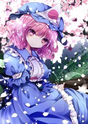 Rule 34 | 1girl, blue dress, blue hat, blurry, blurry background, blurry foreground, branch, breasts, center frills, cherry blossoms, closed mouth, dress, flower, frilled dress, frills, hair between eyes, hat, head tilt, layered sleeves, long sleeves, looking at viewer, medium breasts, mob cap, nanase nao, obi, own hands together, petals, pink flower, pink hair, puffy short sleeves, puffy sleeves, purple eyes, saigyouji yuyuko, sash, short over long sleeves, short sleeves, sleeves past wrists, smile, solo, touhou, triangular headpiece, white hat, wide sleeves