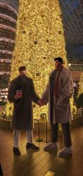 Rule 34 | 2boys, bara, beard, beard stubble, blush, christmas tree, couple, cup, dark-skinned male, dark skin, dating, disposable cup, dobek k, eye contact, facial hair, from side, full beard, full body, happy, height difference, highres, holding hands, large pectorals, looking at another, male focus, mature male, multiple boys, muscular, muscular male, original, pectorals, photo background, red scarf, scarf, short hair, standing, stubble, thick eyebrows, yaoi
