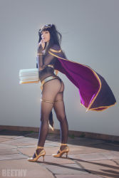 Rule 34 | 1girl, artist name, ass, bangle, beethy, beke (cosplayer), belt, black hair, blunt bangs, bodystocking, book, bracelet, bridal gauntlets, brown eyes, cape, closed mouth, commentary, cosplay, cosplay photo, day, eyelashes, finger to mouth, fire emblem, fire emblem awakening, from behind, full body, high heels, highres, holding, holding book, jewelry, legs apart, lips, long hair, looking back, nail polish, nintendo, open book, photo (medium), purple cape, purple nails, shadow, shoes, smile, solo, standing, stone floor, sunlight, tharja, tharja (cosplay), tharja (fire emblem), thigh strap, tiara, wind, yellow footwear