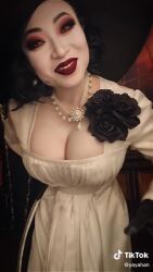 Rule 34 | 1girl, alcina dimitrescu, animated, breasts, capcom, claws, cleavage, cosplay, dress, female focus, flower, gloves, hat, huge breasts, lipstick, looking at viewer, makeup, pale skin, real life, resident evil, resident evil village, short hair, solo, sun hat, tagme, video, yaya han