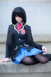 Rule 34 | 1girl, artist request, asian, black hair, black pantyhose, blazer, blue skirt, blurry, color contacts, cosplay, date a live, depth of field, hair over one eye, jacket, long hair, looking at viewer, on floor, pantyhose, photo (medium), pleated skirt, red eyes, school uniform, sitting, skirt, solo, tokisaki kurumi, tokisaki kurumi (cosplay), twintails, yokozuwari