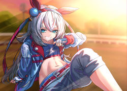 Rule 34 | 1girl, absurdres, animal ears, arm support, bad id, bad pixiv id, blue eyes, blue hairband, blue jacket, blue shirt, blurry, blurry background, capri pants, collarbone, commentary, crop top, cropped shirt, diuda, ear covers, ear ornament, fingerless gloves, gloves, hair between eyes, hairband, headband, highres, horse ears, horse girl, horse racing track, jacket, light rays, lightning bolt print, long hair, long sleeves, looking at viewer, midriff, navel, outdoors, pants, red headband, shadow, shirt, shirt tug, sidelocks, silver hair, sitting, smile, solo, sunbeam, sunlight, sunset, tamamo cross (umamusume), teeth, umamusume, white gloves, white pants