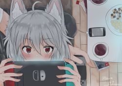 Rule 34 | 1girl, absurdres, ahoge, animal ear fluff, animal ears, artist name, blush, bottle, cable, cellphone, checkerboard cookie, coffee, cola, controller, cookie, couch, cup, food, from above, hair between eyes, hands up, highres, holding, holding controller, inubashiri momiji, iphone, lap pillow, looking at viewer, lying, mug, nintendo switch, no headwear, on back, phone, plate, portrait, red eyes, regua, short hair, signature, silver hair, sitting, smartphone, solo focus, table, tape, touhou, wolf ears, wooden floor