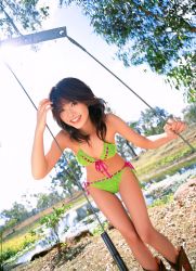 Rule 34 | 1girl, arm support, asian, bikini, blurry, boots, cowboy boots, crochet, depth of field, dutch angle, front-tie bikini top, front-tie top, green bikini, happy, hasebe yu, highres, knit, leaning forward, lipstick, long hair, looking at viewer, makeup, nail polish, outdoors, photo (medium), red lips, side-tie bikini bottom, solo, swimsuit, tagme, tree