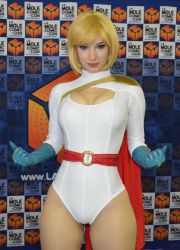 Rule 34 | 1girl, blonde hair, blue eyes, breasts, cameltoe, cape, cleavage, cleavage cutout, clothing cutout, cosplay, dc comics, gloves, highres, photo (medium), power girl, power girl (cosplay), solo, thighs