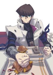 Rule 34 | 1boy, absurdres, artist name, black shirt, blue eyes, brown hair, burger, checkered floor, clenched hands, coat, covered collarbone, deck of cards, food, highres, kaiba seto, looking at viewer, male focus, medium hair, shirt, sitting, skmkst, solo, table, trading card, white coat, yu-gi-oh!, yu-gi-oh! duel monsters