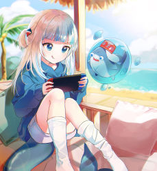 Rule 34 | 1girl, :q, alternate costume, beach, bloop (gawr gura), blue eyes, blue hair, blue hoodie, blunt bangs, closed mouth, commentary, day, fins, fish tail, gawr gura, gawr gura (1st costume), hair ornament, handheld game console, highres, hololive, hololive english, hood, hoodie, indoors, kani (kkk kani), kneehighs, knees up, long hair, long sleeves, multicolored hair, nintendo switch, no shoes, ocean, open mouth, pillow, playing games, shark, shark hair ornament, shark tail, shorts, sitting, sleeves past wrists, socks, streaked hair, tail, tongue, tongue out, two side up, virtual youtuber, white socks