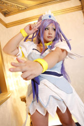 Rule 34 | 1girl, ankle boots, arm up, asian, blue eyes, blue hair, boots, bow, bracelet, breasts, choker, chouzuki maryou, cosplay, cure diamond (cosplay), dokidoki! precure, dress, headpiece, highres, jewelry, large breasts, long hair, magical girl, matching hair/eyes, photo (medium), plump, ponytail, precure, puffy short sleeves, puffy sleeves, ribbon, salute, short sleeves, solo, tiara