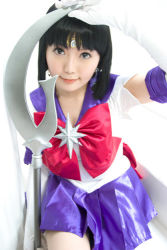 Rule 34 | 1girl, asian, bishoujo senshi sailor moon, bow, cosplay, cosplay photo, holding, holding polearm, holding spear, holding weapon, lowres, magical girl, pantyhose, photo (medium), polearm, purple skirt, red bow, sailor saturn, sailor saturn (cosplay), short hair, silence glaive, skirt, solo, spear, tomoe hotaru, weapon