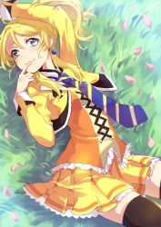 Rule 34 | 10s, 1girl, ayase eli, blonde hair, blue eyes, blush, chiigo, diagonal stripes, earrings, jewelry, looking at viewer, love live!, love live! school idol festival, love live! school idol project, lying, necktie, on back, on grass, open mouth, petals, ponytail, short hair, skirt, smile, solo, spade (shape), spade earrings, striped necktie, striped neckwear, thighhighs, waving