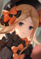 Rule 34 | 1girl, a maru, abigail williams (fate), black bow, black dress, black hat, blonde hair, blue eyes, blurry, blurry background, bow, depth of field, dress, eyes visible through hair, fate (series), hat, highres, long hair, looking at viewer, orange bow, parted bangs, parted lips, portrait, smile, solo