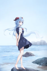 Rule 34 | 1girl, absurdres, ahoge, arms behind back, bare legs, barefoot, black dress, blouse, blue hair, blue sky, breasts, closed mouth, day, dress, from side, full body, ganyu (genshin impact), genshin impact, highres, horizon, horns, long hair, looking at viewer, looking to the side, medium breasts, ocean, outdoors, own hands together, pinafore dress, purple eyes, raku (clearpage), rock, shirt, short sleeves, sky, sleeveless, sleeveless dress, smile, solo, standing, very long hair, water, white shirt