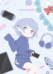 Rule 34 | 1girl, blue eyes, blue jacket, blue nails, blue shorts, blush, character name, closed mouth, commentary, creature, duel disk, expressionless, feet out of frame, from above, gym shorts, hair ornament, half-closed eyes, handheld game console, headphones, headphones removed, highres, holding, holding phone, indie utaite, jacket, looking at viewer, looking to the side, lying, mask, messy hair, on side, phone, playstation portable, ringed eyes, short hair, shorts, sleep mask, sleeves past wrists, solo, stylus, tablet pc, takanashi natsuo, track jacket, two side up, unworn mask, utaite, v, wotoha (character), yu-gi-oh!