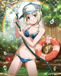 Rule 34 | 1girl, bikini, blonde hair, blue eyes, blush, breasts, bucket, bush, camouflage, camouflage bikini, card (medium), cleavage, erica hartmann, gluteal fold, grass, holding, holding hose, hose, innertube, leaf, lifebuoy, navel, o-ring, o-ring bottom, o-ring top, official art, outdoors, rainbow, short hair, small breasts, smile, solo, strike witches, swim ring, swimsuit, tree, water, wet, wood, world witches series