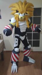 Rule 34 | animated, armor, claws, cosplay, digimon, fangs, grappuleomon, grappuleomon (cosplay), lion, long hair, looking at viewer, photo (medium), real life, sharp teeth, tail, teeth, video