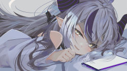 Rule 34 | 1girl, :d, anzi, bare shoulders, bed sheet, blush, cellphone, commentary request, demon horns, fang, grey background, grey hair, hair between eyes, half-closed eyes, hand up, highres, hololive, horns, la+ darknesss, long hair, long sleeves, looking at viewer, lying, multicolored hair, on stomach, open mouth, phone, purple hair, shirt, simple background, smile, solo, streaked hair, striped horns, virtual youtuber, white shirt, yellow eyes
