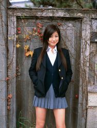 Rule 34 | 1girl, asian, blazer, brown hair, cardigan, cosplay, highres, long hair, looking at viewer, miniskirt, photo (medium), pleated skirt, school uniform, skirt, solo, sugimoto yumi
