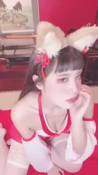 Rule 34 | 1girl, animal ears, animated, asian, bare legs, breasts, cleavage, cosplay, fake animal ears, fingernails, grin, japanese (nationality), japanese clothes, kneeling, lips, looking at viewer, model, photo (medium), ririkana, shiny skin, smile, solo, sound, video