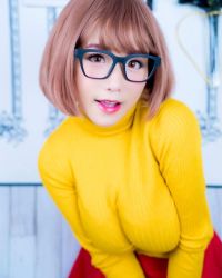 Rule 34 | 1girl, breasts, brown eyes, brown hair, clothes, cosplay, female focus, glasses, highres, large breasts, looking at viewer, medium hair, model, photo (medium), scooby-doo, shibuya kaho, solo, velma dace dinkley, velma dace dinkley (cosplay), wig