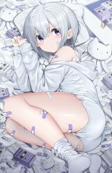 Rule 34 | 1girl, absurdres, arms up, ass, bandaid, bandaid on arm, bandaid on cheek, bandaid on face, bandaid on hand, bandaid on knee, bandaid on leg, bed sheet, box, commentary request, grey hair, grey hoodie, grey shorts, grey socks, highres, hood, hood down, hoodie, long sleeves, lying, neku (neku draw), no shoes, off shoulder, on side, original, pillow, puffy long sleeves, puffy sleeves, short shorts, shorts, sleeves past wrists, socks, solo, stuffed toy