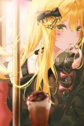 1girl backlighting black_bow black_sweater blonde_hair blurry blurry_foreground blush bow closed_mouth facial_mark green_eyes hair_between_eyes hair_bow hair_ornament hairclip highres isobe47 lens_flare long_hair long_sleeves original solo sweater