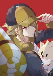 Rule 34 | 1boy, backpack, bag, blonde hair, blurry, brown bag, closed mouth, commentary request, creatures (company), eyelashes, fingernails, game freak, gen 2 pokemon, hair over one eye, hand on headwear, hand up, hat, highres, jumpsuit, looking at viewer, male focus, nintendo, pokemon, pokemon (creature), pokemon legends: arceus, red background, simple background, ssn (sasa8u9r), togepi, volo (pokemon), yellow headwear