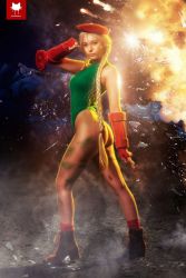 Rule 34 | 1girl, ass, back, beke (cosplayer), blonde hair, boots, cammy white, cammy white (cosplay), cosplay, explosion, fire, from behind, glass, hat, leotard, long hair, looking at viewer, photo (medium), solo, street fighter, thong, thong leotard, twintails