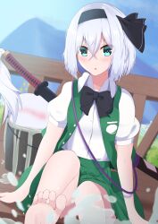 1girl absurdres aqua_eyes barefoot black_hairband blue_sky blurry blurry_background blush breasts buttons collared_shirt depth_of_field foot_out_of_frame green_skirt green_vest grey_hair hair_between_eyes hairband head_tilt highres hitodama hitodama_print katana kirisame_oreo konpaku_youmu konpaku_youmu_(ghost) looking_at_viewer medium_hair mountainous_horizon open_mouth outdoors pleated_skirt puffy_short_sleeves puffy_sleeves shirt short_sleeves skirt skirt_set sky small_breasts soles sword touhou vest weapon white_shirt