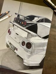 Rule 34 | art tools in frame, black car, car, colored pencil, colored pencil (medium), commentary, english commentary, hannah (handrawnby), highres, license plate, nissan, nissan skyline, nissan skyline gt-r, nissan skyline r34, no humans, original, pencil, photo (medium), photo (object), shadow, spoiler (automobile), traditional media, vehicle focus, white car