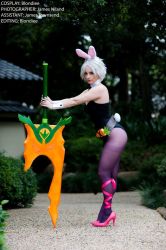 Rule 34 | 1girl, animal ears, belt, bent over, blondiee, carrot, cosplay, detached collar, english text, fake animal ears, forest, hair ornament, high heels, league of legends, legs, leotard, looking at viewer, makeup, nature, necktie, outdoors, pantyhose, photo (medium), pink ribbon, playboy bunny, purple pantyhose, rabbit ears, rabbit tail, ribbon, riven (league of legends), short hair, sword, tail, thighband pantyhose, weapon, white hair, wrist cuffs