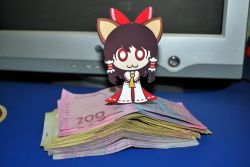 Rule 34 | 1girl, :3, animal ears, bow, brown eyes, cat ears, cat girl, chibi, detached sleeves, female focus, hair bow, hakurei reimu, japanese clothes, miko, money, paper child, papercraft (medium), photo (medium), solo, touhou, unconventional media