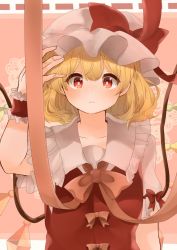 Rule 34 | 1girl, blonde hair, bow, breasts, closed mouth, collarbone, commentary request, crystal, flandre scarlet, frilled shirt collar, frills, hand on headwear, hat, hat bow, laspberry., mob cap, orange bow, orange ribbon, puffy short sleeves, puffy sleeves, red bow, red eyes, red vest, ribbon, shirt, short hair, short sleeves, small breasts, touhou, vest, white hat, white shirt, wings, wristband