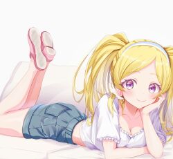 Rule 34 | 1girl, absurdres, bare legs, blonde hair, blush, breasts, cleavage, collarbone, couch, cropped shirt, denim, denim shorts, emily stewart, eyebrows hidden by hair, feet up, hairband, hand on own cheek, hand on own face, head rest, highres, idolmaster, idolmaster million live!, looking at viewer, lying, on stomach, purple eyes, saki nerikeshi, shorts, small breasts, smile, solo, the pose, twintails