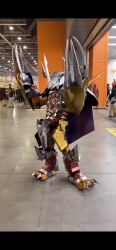 Rule 34 | animated, armor, audible music, claws, cosplay, digimon, green eyes, highres, horns, looking at viewer, photo (medium), real life, sound, video, wargreymon, wargreymon (cosplay)