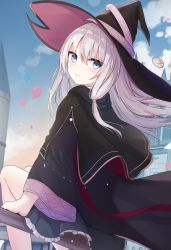 Rule 34 | 1girl, balloon, black hat, black robe, blue eyes, blurry, blurry background, day, elaina (majo no tabitabi), from behind, hair between eyes, hat, highres, long hair, long sleeves, looking at viewer, looking back, majo no tabitabi, outdoors, robe, silver hair, sitting, smile, solo, touhourh, wind, witch hat