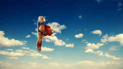 Rule 34 | 1girl, belt, blonde hair, blue sky, boots, cape, cloud, dc comics, floating, floating hair, highres, midriff, navel, red cape, skirt, sky, solo, supergirl, tan, tanline, undressing