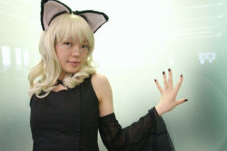 Rule 34 | 1girl, animal ears, asian, bare shoulders, black dress, black nails, blonde hair, breasts, cat ears, cosplay, detached sleeves, dress, elfriede, elfriede (cosplay), fake animal ears, glass wall, glasses, hand on wall, long hair, looking at viewer, looking over eyewear, mole, nail polish, namada, photo (medium), reflection, rimless eyewear, see-through, small breasts, solo, standing, tsukuyomi moonphase, upper body